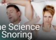 man snoring in bed with woman covering her ears with a pillow